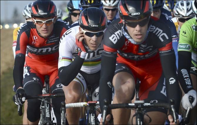 World champion Philippe Gilbert (BMC) gets some information from his team car.