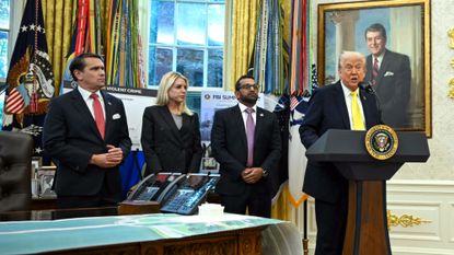 President Donald Trump speaks alongside Justice Department leaders in the Oval Office