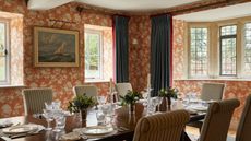 A wallpapered dining room