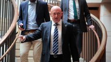 Sen. Mark Kelly (D-Ariz.) leaves breifing in the Capitol.