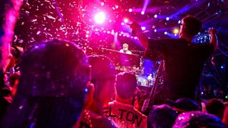 Crowds at Glastonbury enjoy Elton John's headline show on the Pyramid Stage