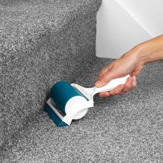 lint roller with stairs and white walls