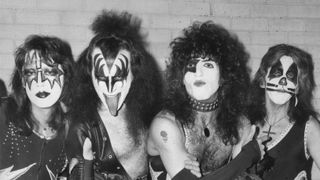 Kiss arrive at London airport for their first European tour, already sporting black and silver make up and costumes. From left to right they are guitarist Ace Frehley, lead singer Gene Simmons, guitarist Paul Stanley and drummer Peter Criss.