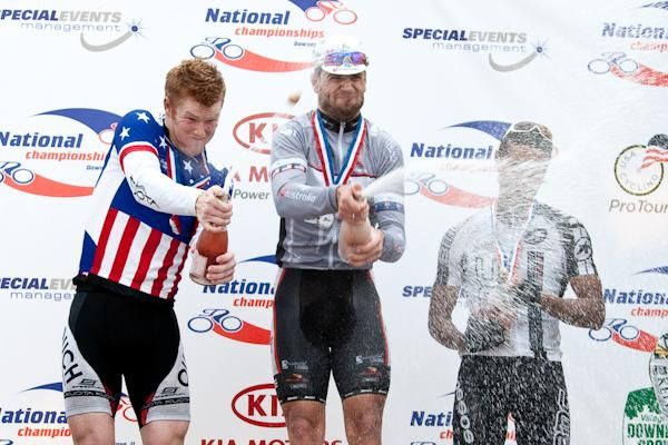 The day's top three get busy with the bubbly.