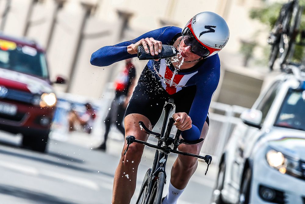 Brandon McNulty takes a drink during the time trial world championships in Qatar
