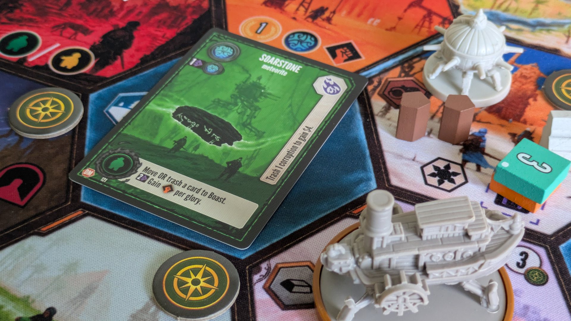 Duel of Meloch cards, tokens, and miniatures on the board