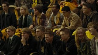 Two rows of Hufflepuff students sitting in bleachers.