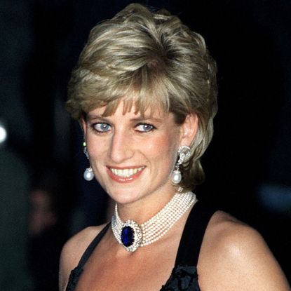 Princess Diana wears a pearl and sapphire choker and a black dress