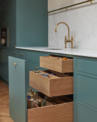 pull out kitchen drawers with jars neatly stacked