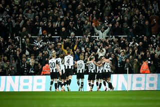 Newcastle United's English midfielder #23 Jacob Murphy (rear R) celebrates with teammates after scoring his team first goal during the English League Cup semi-final second leg football match between Newcastle United and Arsenal at St James' Park, in Newcastle-upon-Tyne, north east England, on February 5, 2025. (Photo by Paul ELLIS / AFP) / RESTRICTED TO EDITORIAL USE. No use with unauthorized audio, video, data, fixture lists, club/league logos or 'live' services. Online in-match use limited to 120 images. An additional 40 images may be used in extra time. No video emulation. Social media in-match use limited to 120 images. An additional 40 images may be used in extra time. No use in betting publications, games or single club/league/player publications. / (Photo by PAUL ELLIS/AFP via Getty Images)