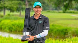Carlos Ortiz celebrates with the trophy after winning LIV Golf Houston