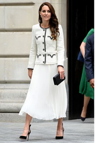 Catherine, Princess of Wales wears a white co-ord and black shoes as she attends the reopening of the National Portrait Gallery in London, United Kingdom on June 20, 2023.