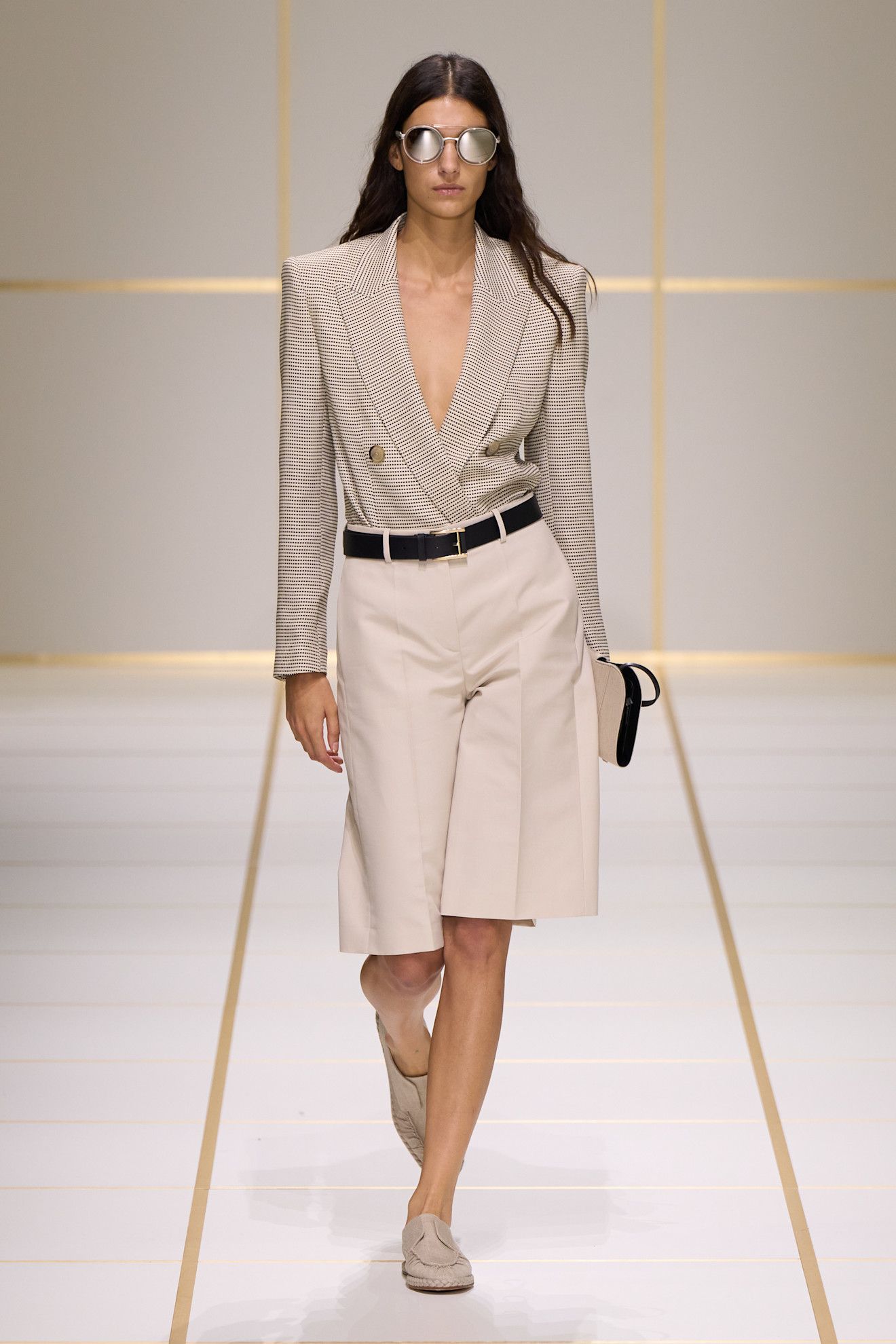 a model walks the giorgio armani s/s 27 runway.