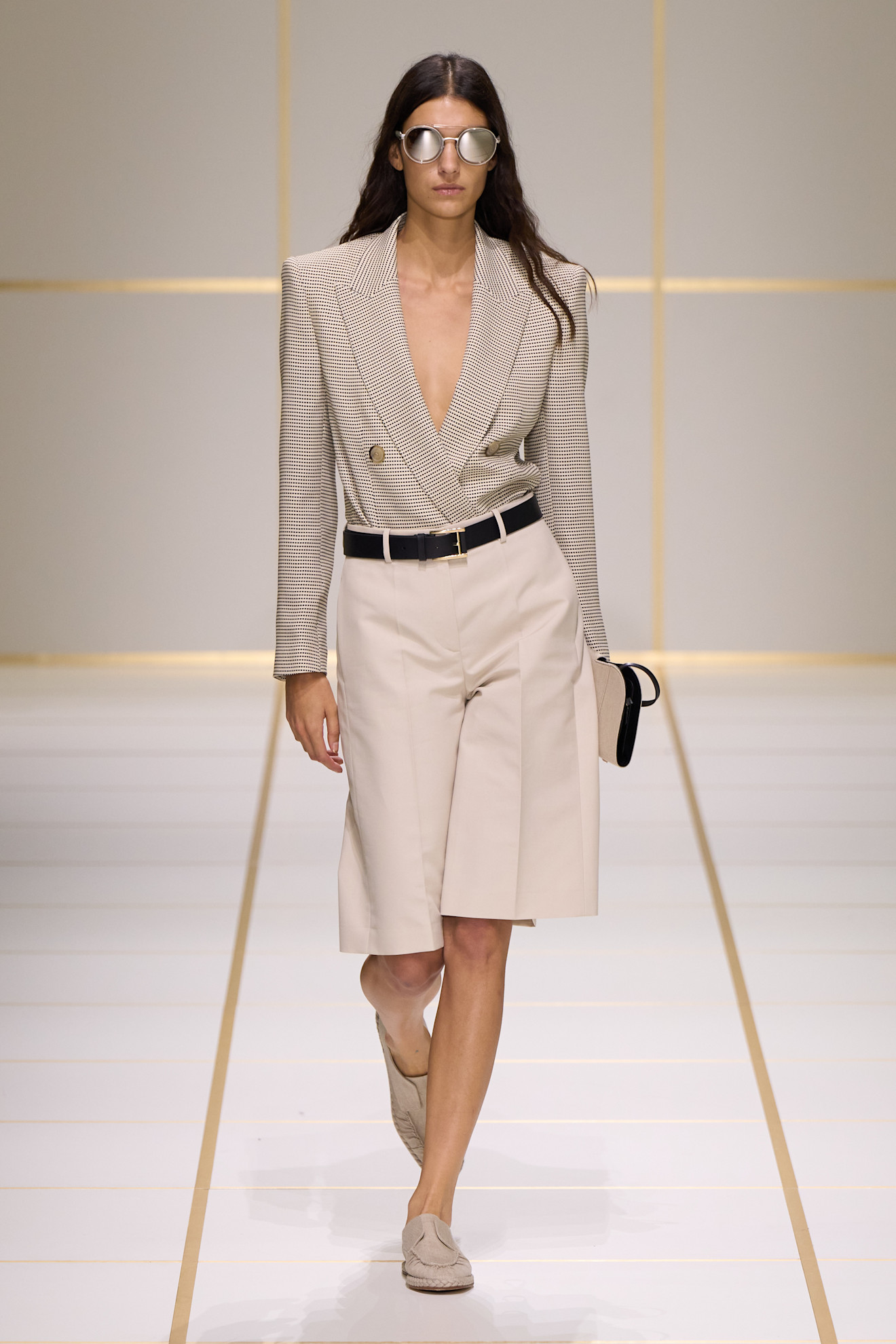 a model walks the giorgio armani s/s 27 runway.