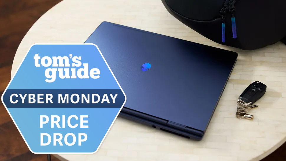 Alienware 16 Aurora laptop on a table with a Tom's Guide Cyber Monday deals badge