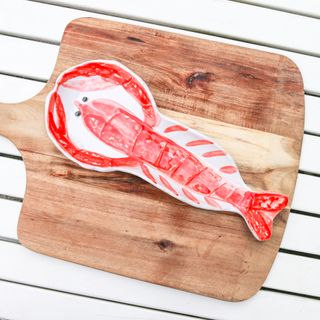 lobster dish on wooden board