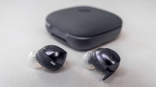Sennheiser Momentum Sport earbuds loose with closed case.