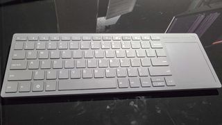 The Framework Wireless Touchpad Keyboard on a table