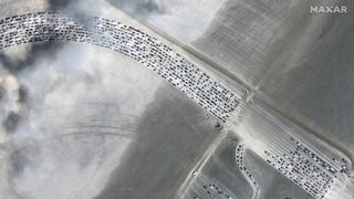 The traffic can already be seen days ahead of this year's Burning Man, as seen in satellite images released by Maxar Technologies.