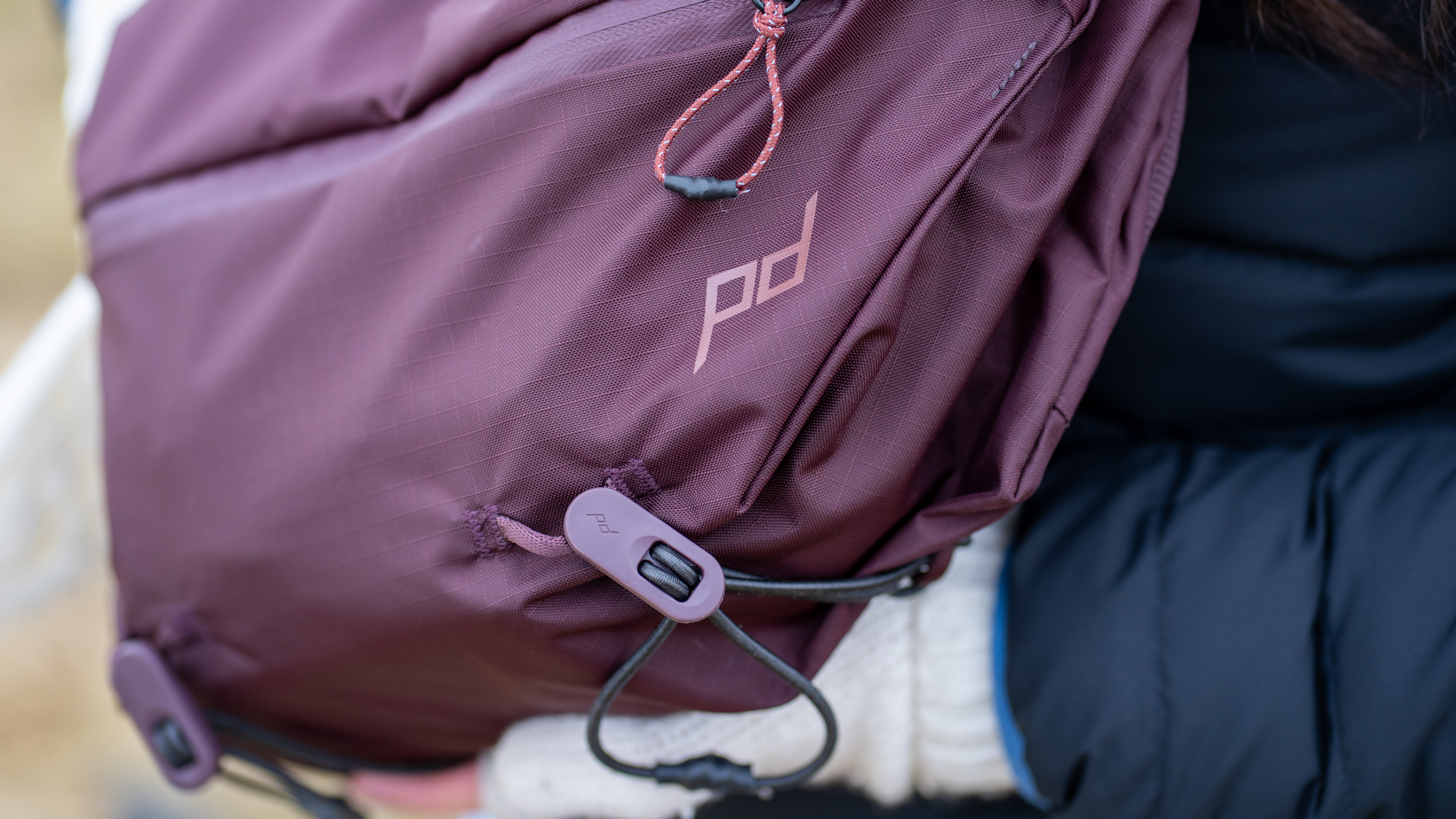 close up of the elastic cord gear loops on the Peak Design 7L Outdoor Sling Bag