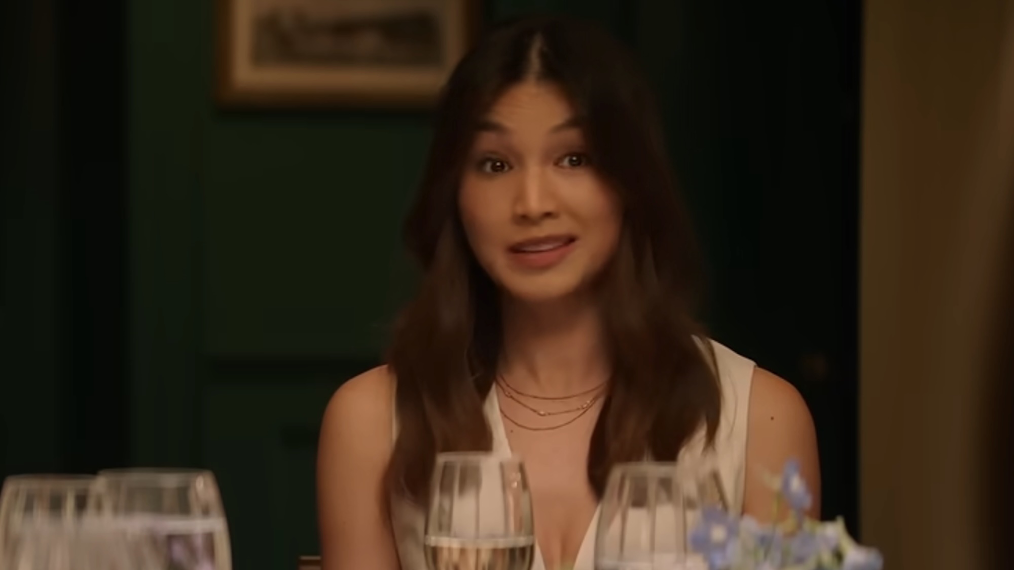 Gemma Chan at the dinner table in The Five Star Weekend