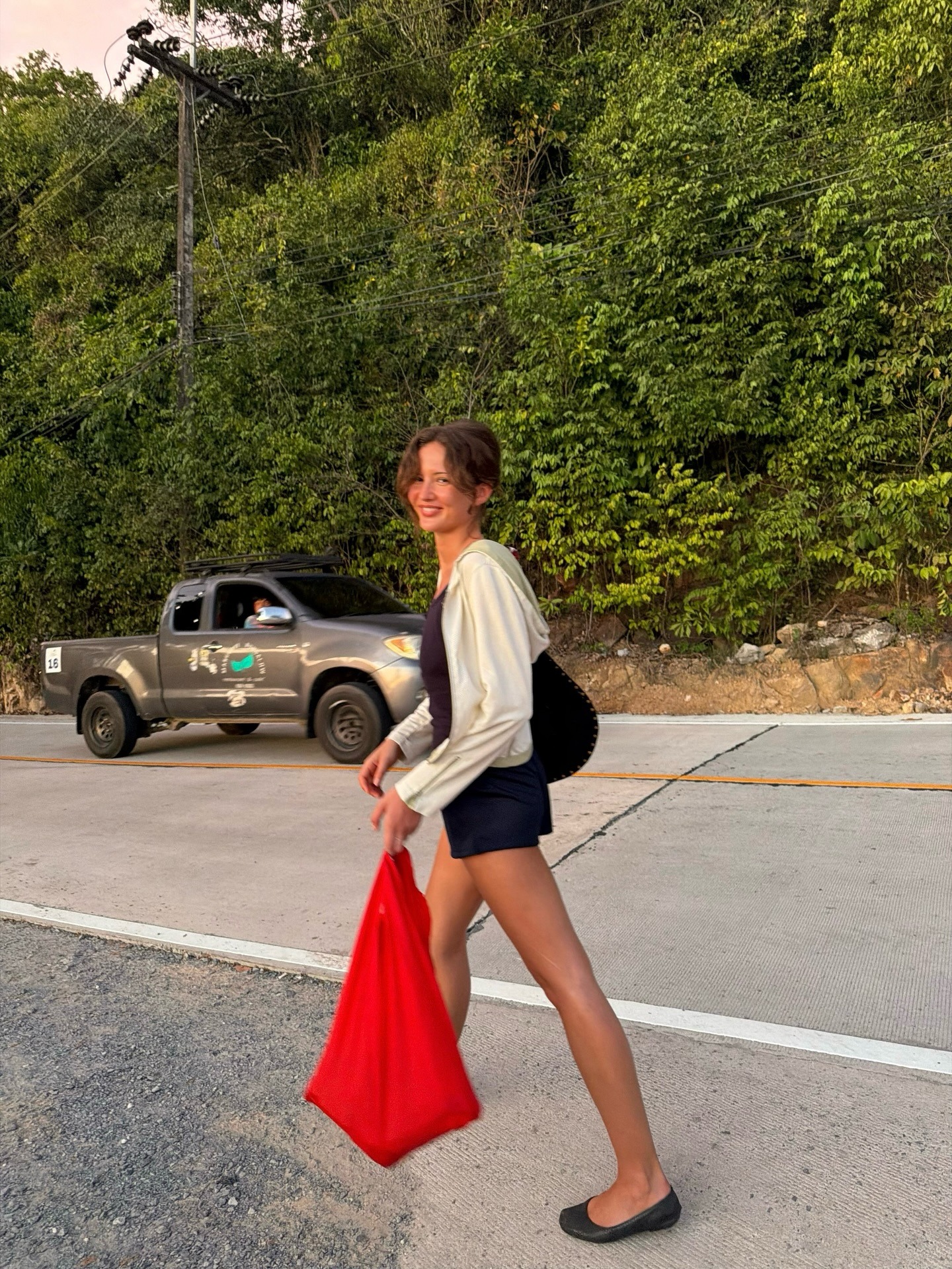 Woman in micro shorts and ballet flats.