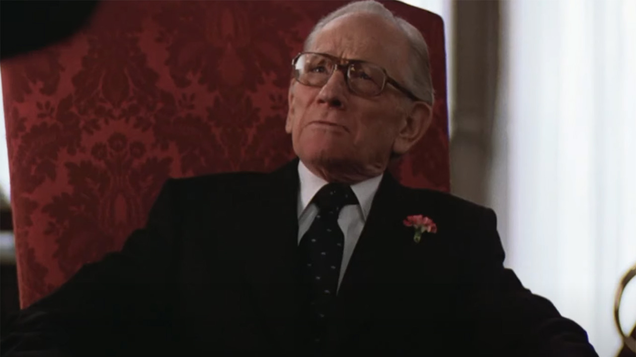 Melvin Douglas in his chair in Being There.