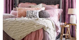 cosy bedroom with extra blankets on the bed