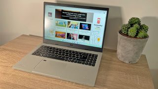 Acer Aspire Vero review: laptop screen with website open next to a plant