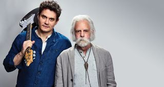 John Mayer and Bob Weir [left] of Dead & Company photographed against a grey background. Mayer wears a blue overshirt and has his signature Silver Sky on his shoulder. Weir wears grey and a bolo tie.