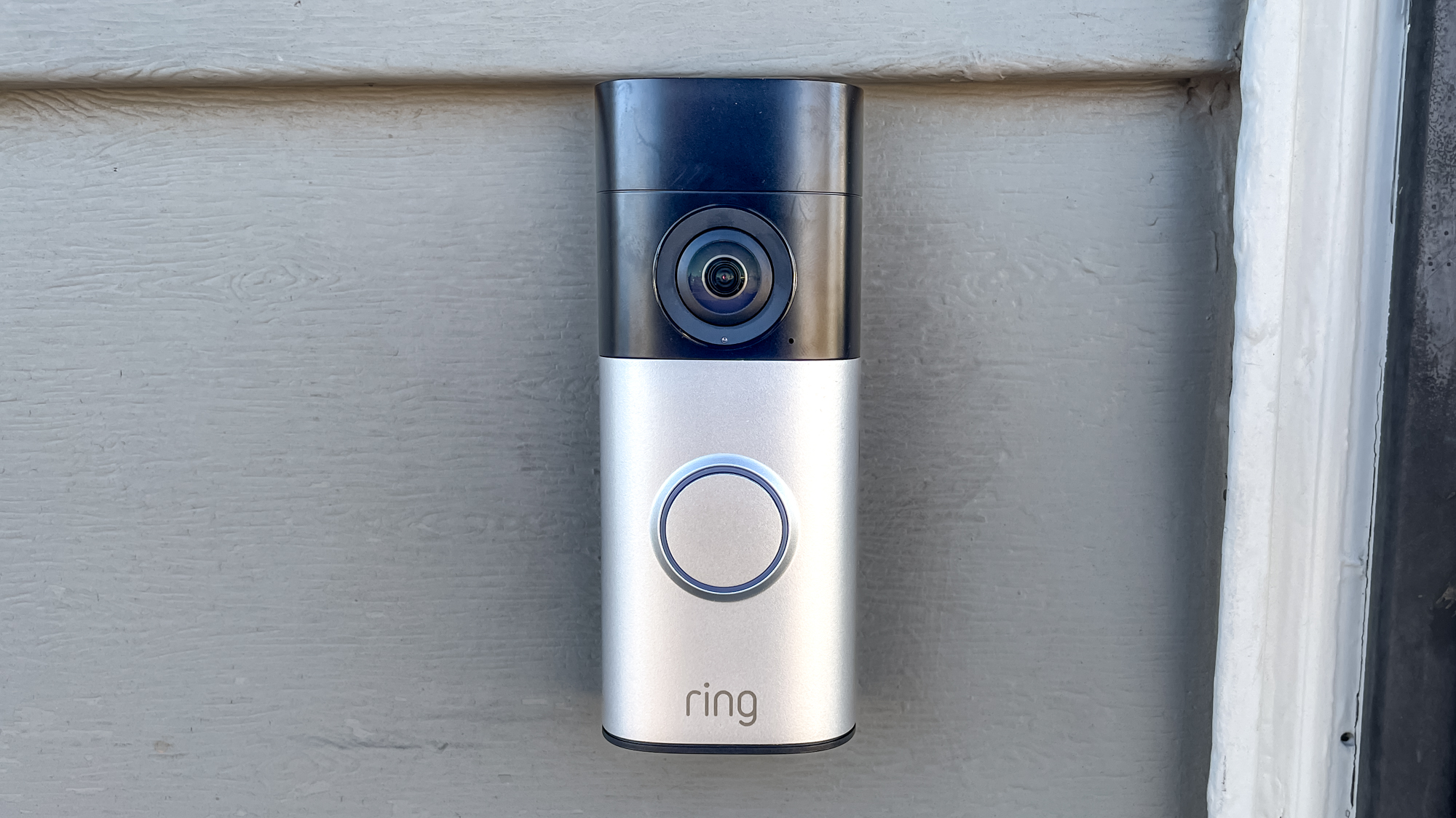Ring Wired Doorbell Plus (2nd gen) mounted next to a front door