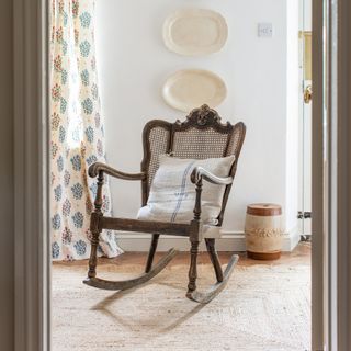 american dark wood rocking chair in a whitewashed country room