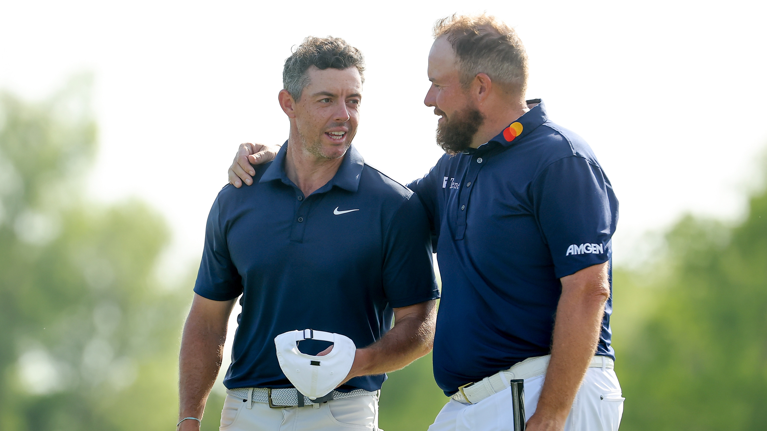 Shane Lowry with his arm around Rory McIlroy at the 2025 Zurich Classic