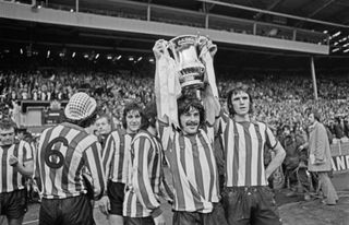 Sunderland FC captain Bobby Kerr holds up the trophy after his team won the FA Cup Final against Leeds United at Wembley Stadium in London, with a score of 1-0, UK, 5th May 1973. (Photo by Evening Standard/Hulton Archive/Getty Images)