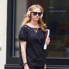 Julia Roberts wearing a black puff-sleeve top with balloon pants and silver Birkenstock Gizeh sandals in NYC