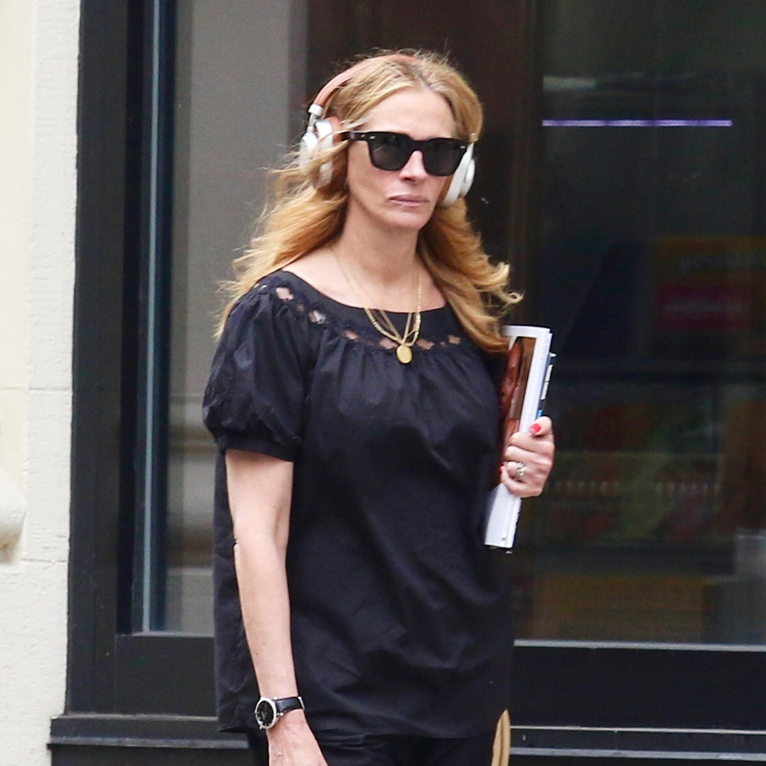 Julia Roberts wearing a black puff-sleeve top with balloon pants and silver Birkenstock Gizeh sandals in NYC