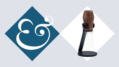 A wooden handled WDT needle tool on a Homes & Gardens blue diamond background. 