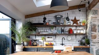 Kitchen with open shelving and wooden island