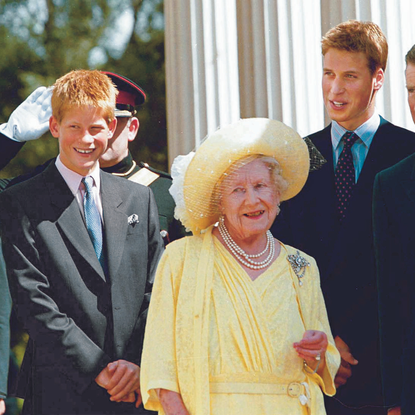 Queen Mum Elizabeth surrounded by great-grandsons Prince Henry (L) and Prince William (2R) and grandson Prince Charles at her 99th birthday celebration at Clarence House.