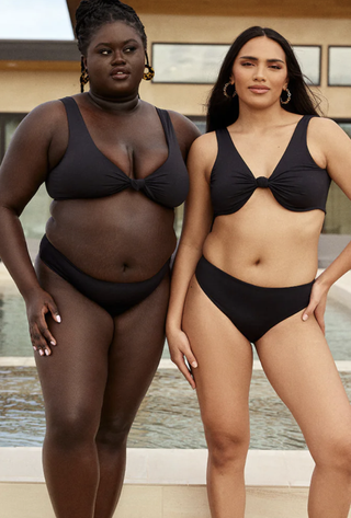 two women wearing black bikinis