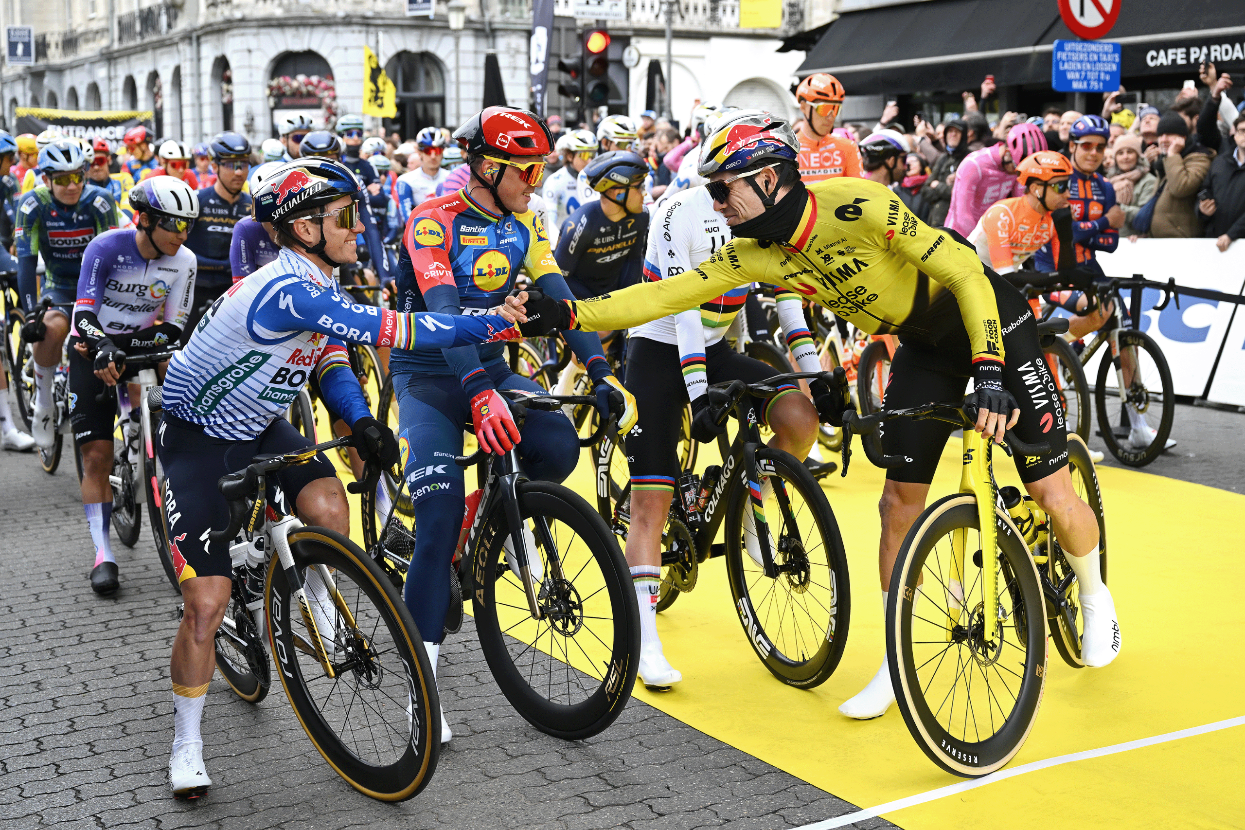 Remco Evenepoel and Wout van Aert shake hands on the start line of the 2026 Tour of Flanders