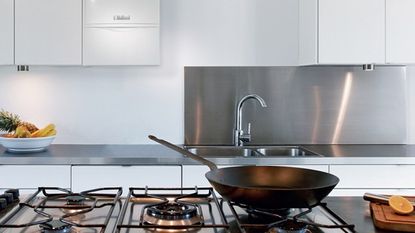 kitchen with steel cooking stove and black frying pan