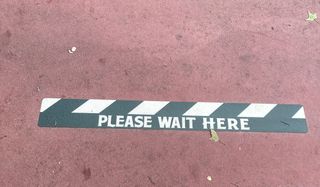 Please Wait Here Sign at Magic Kingdom