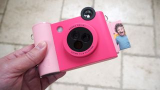 Kodak Smile+ camera in pink held in a hand