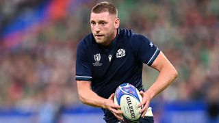 Finn Russell runs with the ball at the Six Nations 2024