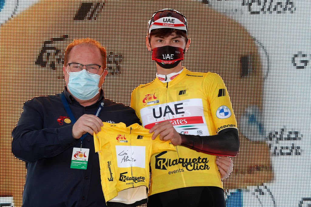 OTURA SPAIN FEBRUARY 18 Alessandro Covi of Italy and UAE Team Emirates celebrates winning the yellow leader jersey on the podium ceremony after the 68th Vuelta A Andalucia Ruta Del Sol 2022 Stage 3 a 1532km stage from Lucena to Otura 68RdS on February 18 2022 in Otura Spain Photo by Bas CzerwinskiGetty Images