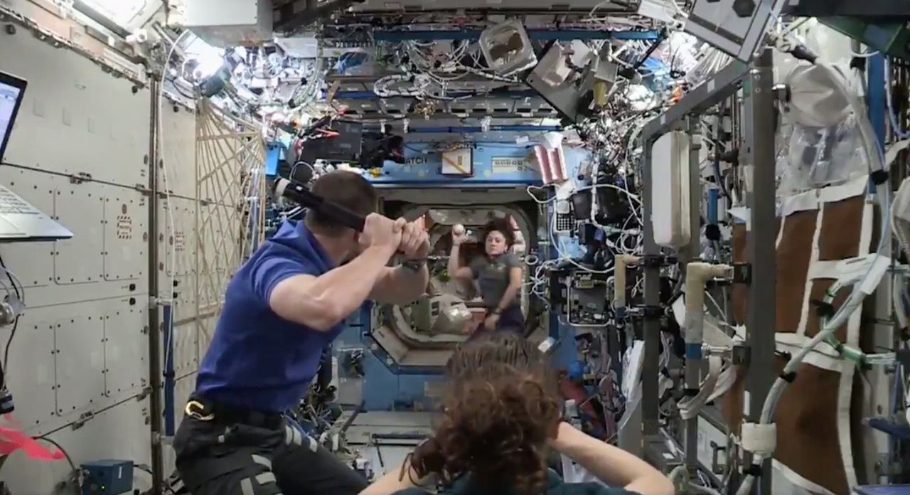NASA astronauts Jessica Meir, Drew Morgan and Christina Koch play some baseball on the International Space Station in October 2019 to celebrate the World Series between the Washington Nationals and the Houston Astros.