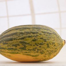 green and yellow melon with white background