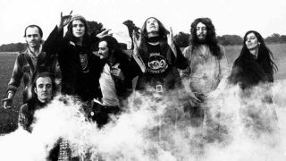 Canterbury Scene band Gong posing for a photograph with a smoke bomb in the early 70s