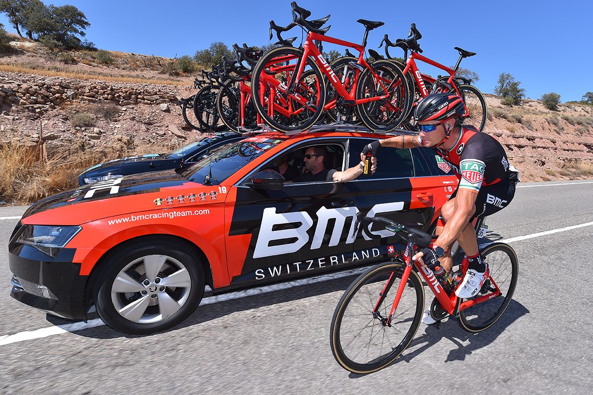 Nicolas Roche drops back to collect some bidons